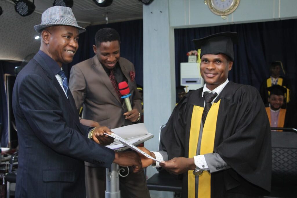 Professor Mkpa Agu Mkpa Presenting the certificate